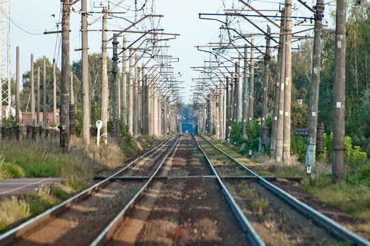 In the photo there is an electrified railway without trains