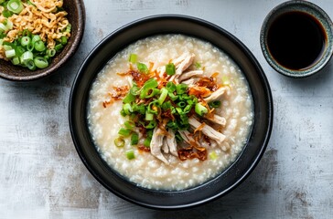 Healthy food traditional chicken congee with fried onions and scallions