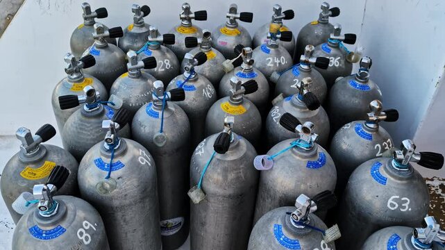 Scuba Diver Tanks, Gas Cylinder Refill. High Angle Shot