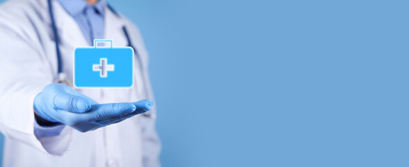 Doctor showing first aid kit symbol. Medical. Business