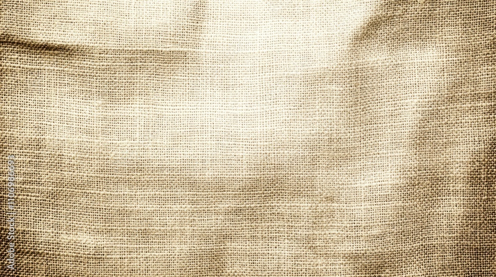 Poster a textured fabric background with a warm, neutral tone, suitable for design and presentations.