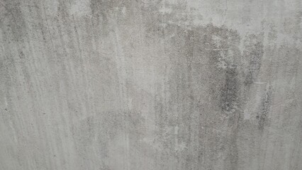 Grungy, textured concrete wall. Perfect for industrial backgrounds.