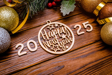 Happy new year 2025 on wooden brown background
