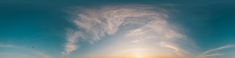 360 panorama of glowing sunset sky with bright Cirrus clouds. HDR 360 seamless spherical panorama. Full zenith or sky dome sky replacement for aerial drone panoramas. Climate and weather change.