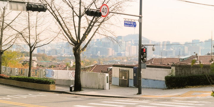 Autumnal street view of Jongno with a cityscape in the background, in Seoul, Korea, in a peaceful and serene atmosphere