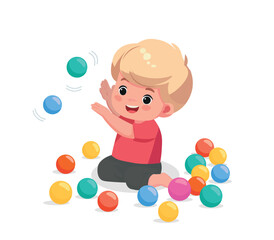 cute little baby boy playing with colorful balls