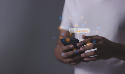 Customer Review, Young Man hand using smartphone mobile with five star to review and give 5 stars...
