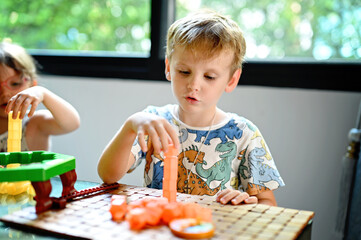 Sibling with board game