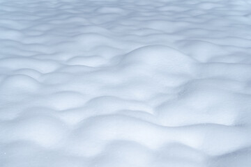 Close-up at purify white snowflake with softness surface that the snow falling on ground. Background and texture from nature condition.