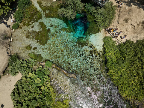 Aerial drone panorama landscape of Blue Eye (aka Syri i Kalter, springs of Bistrice) water spring. Located in Muzine in Finiq municipality, Albania