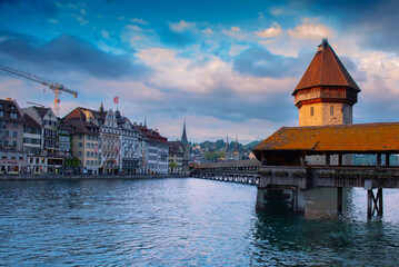 Historic city center of Lucerne with famous buildings and old wooden Chapel bridge spanning the...