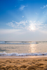 Fototapeta premium The beach by the ocean is empty and the sky is blue
