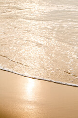 An ocean beach with calm waves