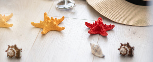 Summer time background. Travel concept Sand and shells on the wooden floor