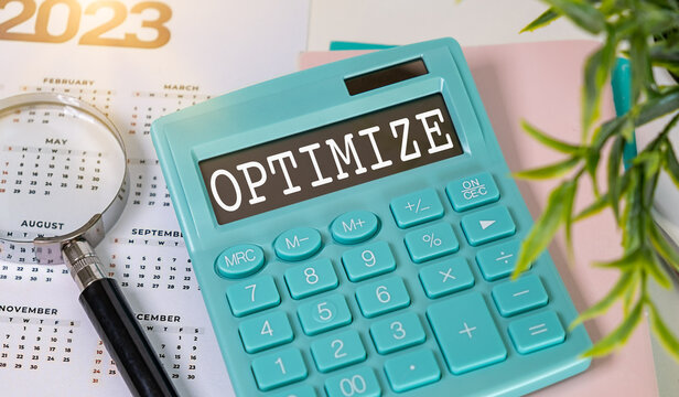 Calculator with the word OPTIMIZE on the display. Business Concept.