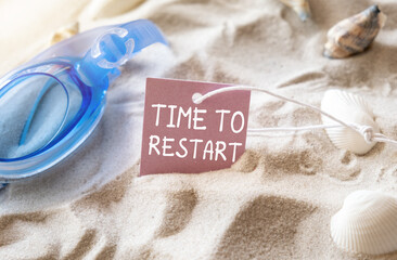 Time to Restart text on paper pink card on background of funny starfish in glasses summer vacation...