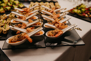 Shrimp in batter with sauce on a buffet table