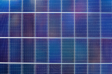 background of double-sided solar panels. Solar energy economy and the crisis of electric power...