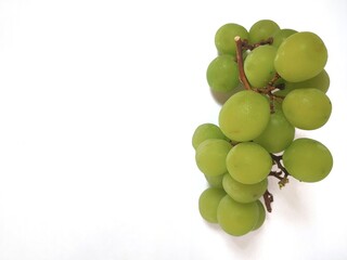 Close-up of green grapes isolated on white background
