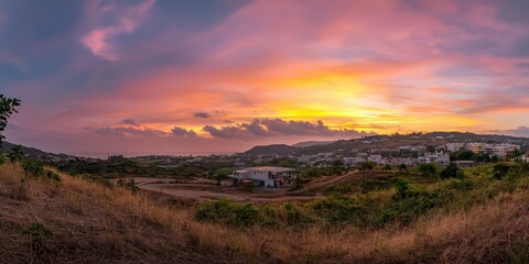 Obraz premium A panoramic view of a sky filled with shades of orange and pink during sunset, capturing the beauty of twilight.