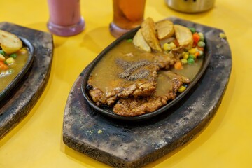 Mouthwatering paper chicken paired with crispy fries and fragrant herbs. The perfect comfort food!