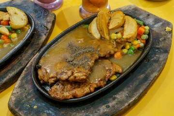 Mouthwatering paper chicken paired with crispy fries and fragrant herbs. The perfect comfort food!