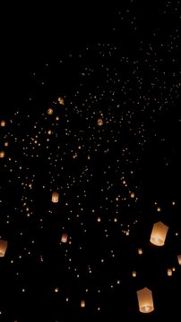 Tourist floating sky lanterns in Loy Krathong festival , Chiang Mai ,Thailand. Vertical Video.