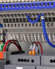 Connection of electrical modules using insulated mounting wires. Close-up. Soft focus.