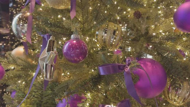 Vibrant Christmas Tree with Glittering Lights in Cozy Holiday Setting.