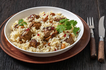 beef and rice in white bowl, top view