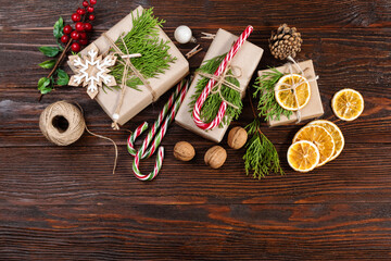 Christmas and zero waste, eco friendly packaging gift on wooden background. Eco christmas holiday concept. Sustainable christmas. Flat lay.