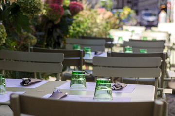 Set table with dishes and chairs in an outdoor restaurant