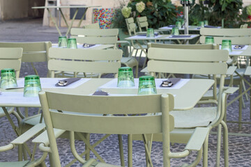 Set table with dishes and chairs in an outdoor restaurant