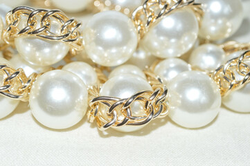 white pearl jewellery with gold chain 
