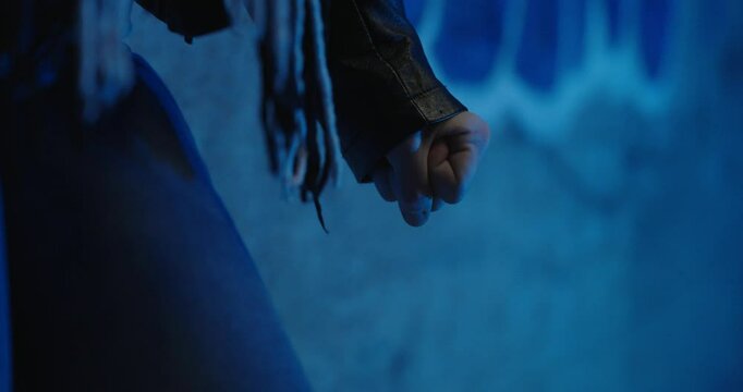 an angry woman makes a fist