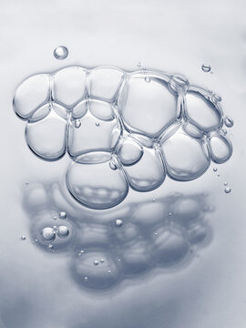 Clear cosmetic gel serum oil bubble texture background Hyaluronic skin care moisturizer product sample with bubbles macro