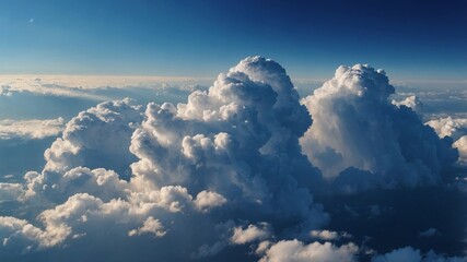 Fluffy clouds drift across a clear blue sky