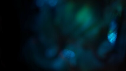 Blurred blue green defocused lens flare motion studio lightning, texture reflection with bokeh...