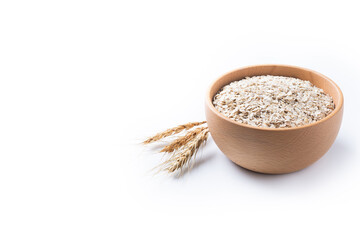 Rolled oats, healthy breakfast cereal oat flakes in bowl isolated on white background. Copy space