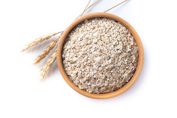 Rolled oats, healthy breakfast cereal oat flakes in bowl isolated on white background. Top view