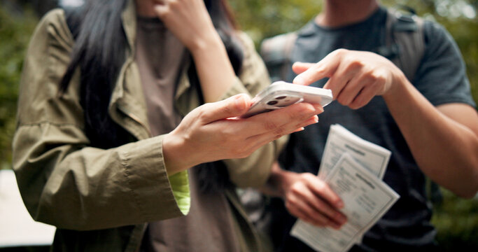 Phone, hands and couple with directions for travel, vacation or weekend trip adventure. Journey, technology and people with cellphone for online navigation for hiking outdoor in nature for holiday. - Powered by Adobe