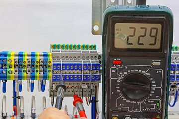 Measurement of electrical parameters using a multimeter.