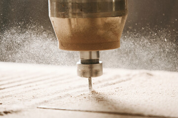 Close-up shot of machine with numerical control cuts wood. Cnc tool.