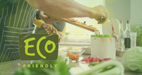 Image of eco friendly text over diverse couple preparing healthy meal in kitchen