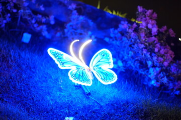 A beautifully illuminated butterfly sculpture featuring vibrant colors, perfect for adding charm to...
