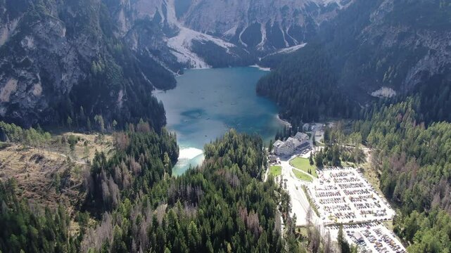 Tilt Down Aerial View of Blue Lake Lago di Braies. Drone Shot