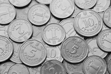 Ukrainian money, exchange coin, white coins of different denomination in random order.