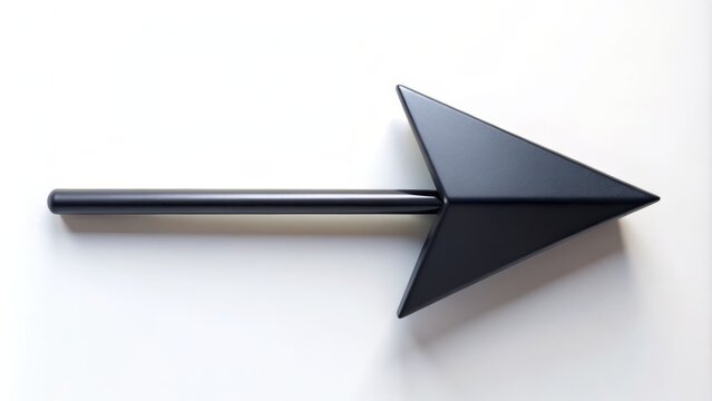Minimalist Macro Photography of a Black Arrow Pointing Right on a Plain White Background, Perfect for Directional Concepts and Graphic Design Projects