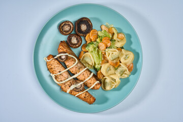 Airfryer salmon with pasta and legumes garnish