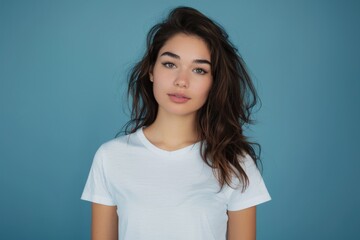 Obraz premium Cute Mockup. Beautiful Woman in Casual White T-shirt on Blue Background